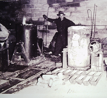 Photo of George Glucina at work in his original factory in West Auckland