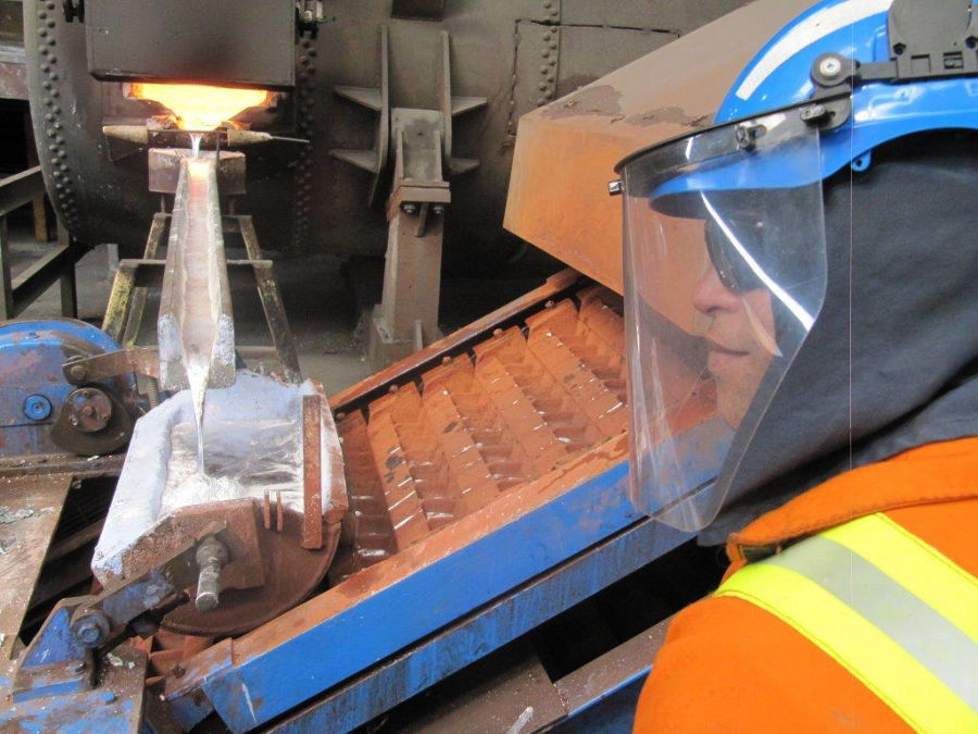 Casting Aluminium puck and closeup of protective headgear.